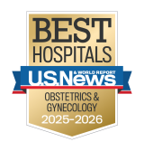 Gold badge with "Best Hospitals" at the top, a blue ribbon with "U.S. News & World Report," and "Obstetrics & Gynecology 2025-2026" below.