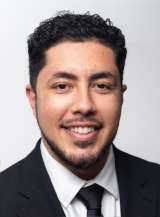 headshot of Antonio Casio-Zuleta in black suit