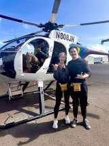Joshua Hubert, DO, MS and his wife taking a helicopter in Hawaii