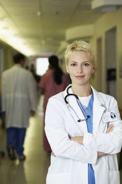 Doctor standing in hallway smiling