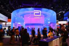 CES 2024 participants walking by showcases