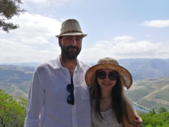 Aline Toukhtarian, MD, and her husband with a mountain background.