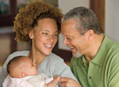 Mother holding child and smiling