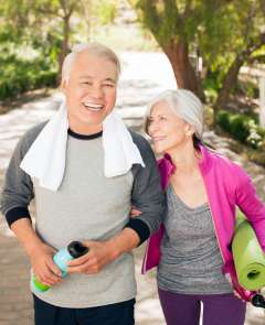 Older couple walking together outdoors