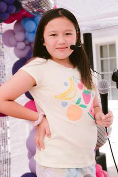 Lilly Martinez with a microphone.