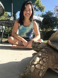Picture of Eileen Nguyen, MD, PhD with a tortise