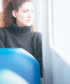 Woman looking out of a window
