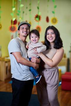 Father and Mother holding baby