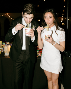 DAPM Resident Physician, Lori Laddaran, MD, and partner eating ramen noodles at wedding