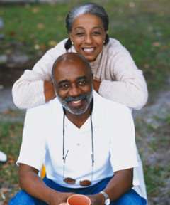 Couple smiling outside