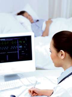 Doctor reading computer screen