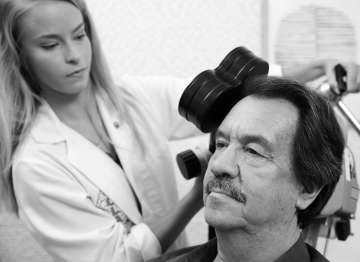 Man undergoes transcranial magnetic stimulation