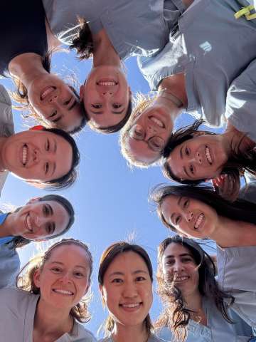A group of physicians smiling