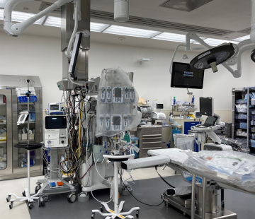 an empty operating room, filled with medical equipment.