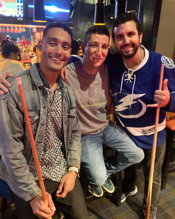 Justin Mitchell, CA-2 resident physician with fellow CA-2s playing pool