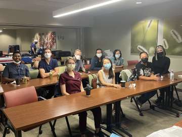Fellows in a lecture room