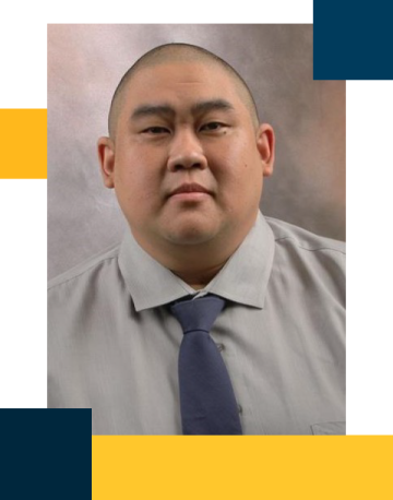 Casey Kaneshiro wearing grey shirt and tie