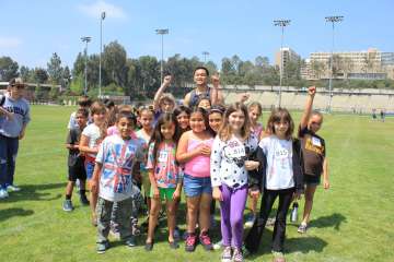 A group of kids playing on the UCLA soccer pitch