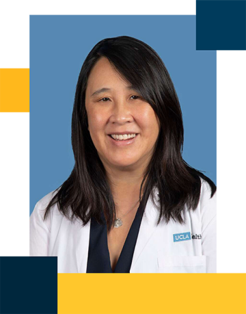 Dr. Mina Ma wearing white coat with black blouse