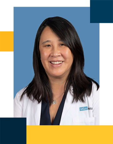 Dr. Mina Ma wearing white coat with black blouse