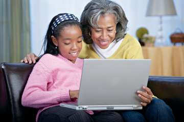 Woman and child using laptop