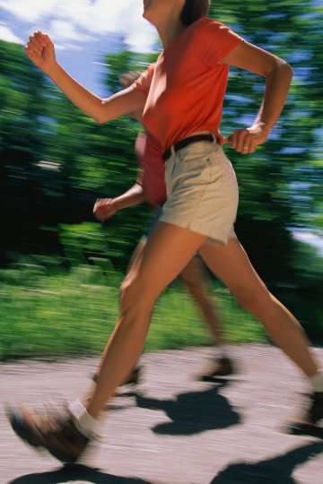 Two people walking outside