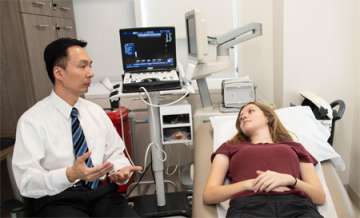 Dr. Harvey Chiu at UCLA with a patient.