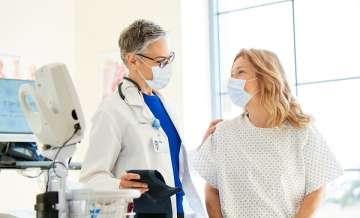 Doctor and patient wearing masks