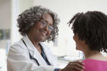 Doctor speaking with patient