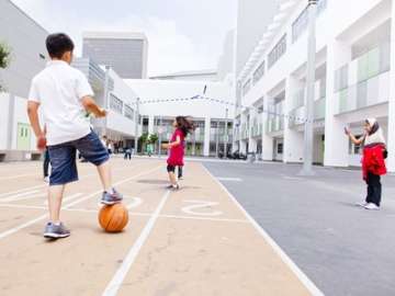Kids outside jump roping