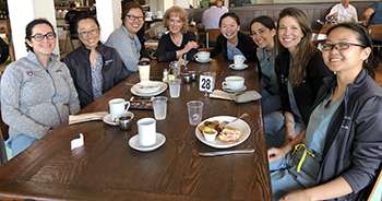 Group of fellows around a table