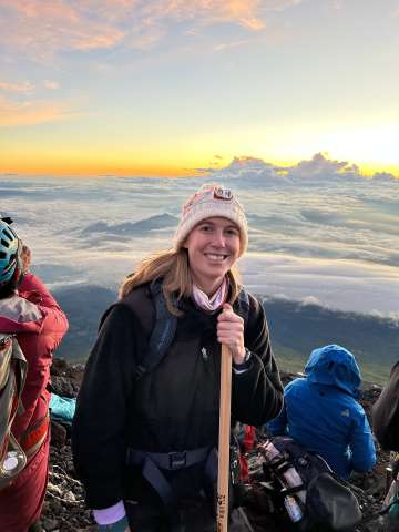 Woman at top of mountain