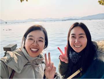 Dr. Tang exploring West Lake with Dr. Lu, with whom I experienced several delicious meals and karaoke jams.