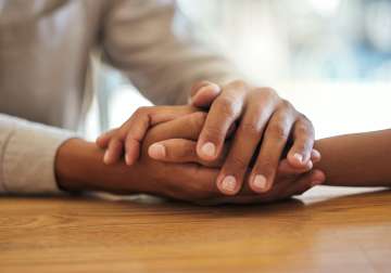 two people holding hands