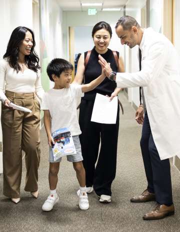 Pediatric IBD team at UCLA Health celebrates with patient and family members