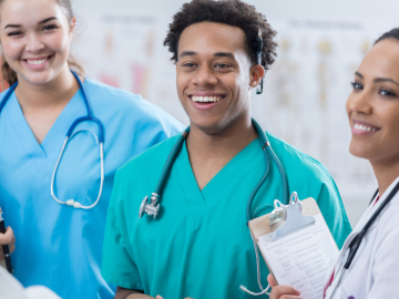 Three medical residents smiling