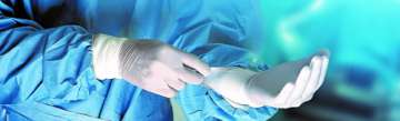 Endoscopist putting on gloves