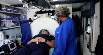 A paramedic doing imaging in the mobile stroke unit
