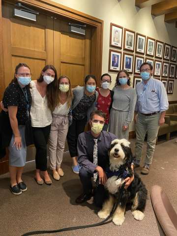 Group of fellows and service animal