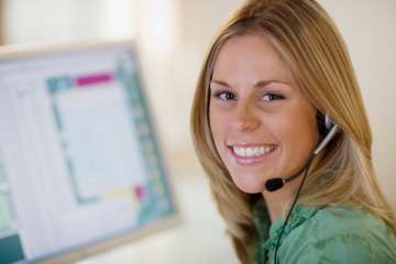 Woman smiling wearing a headset