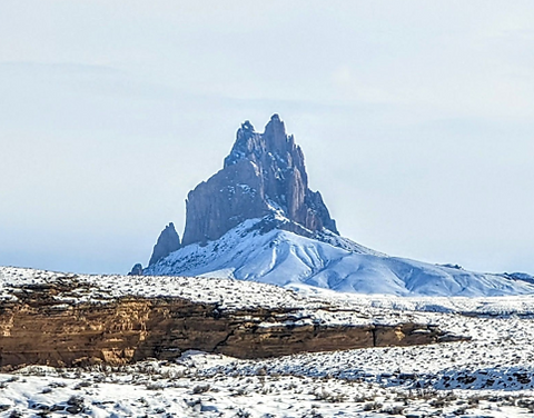 Rock peaks and landscape snowed of IHS Shiprock, New Mexico.
