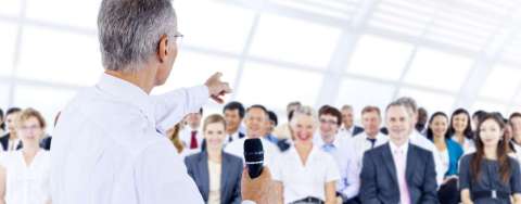 Grand Rounds Reception splash image of group of people in auditorium
