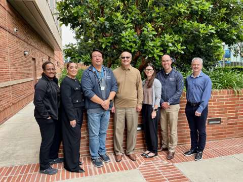 Seven fellowship members standing next to each other during UCLA Bioinformatics & Perioperative Analytics Retreat 2024 