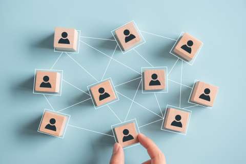 group of tiles with icons of a person all connected with white lines