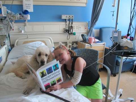 PAC literacy Lexi reading to Apollo