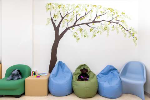 Sensory Room area with bean bag chairs and stuffed animals.