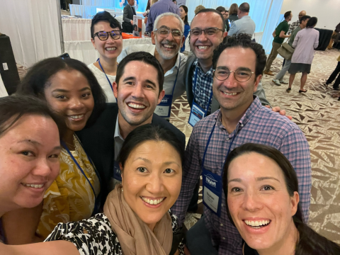 Nine pediatric anesthesiology fellowship members gathered together and posing for a selfie