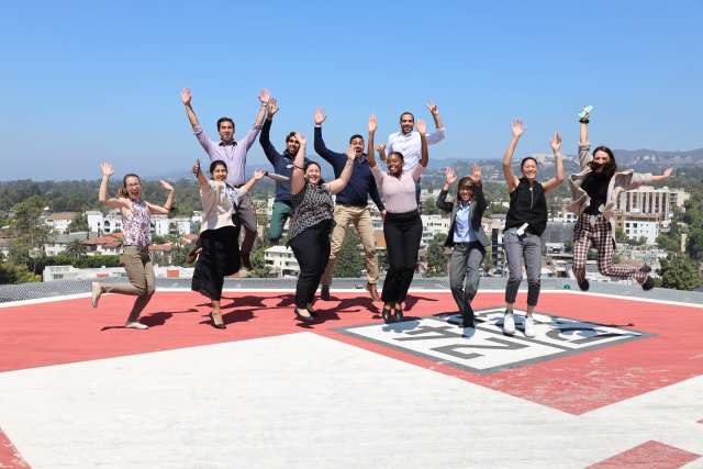 Neurology Residents jumping and smiling