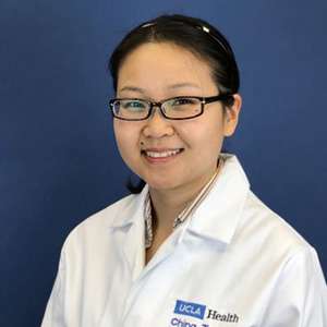headshot of Ching Zhu in white coat