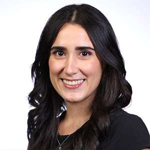 headshot of Maria Velez in black blouse